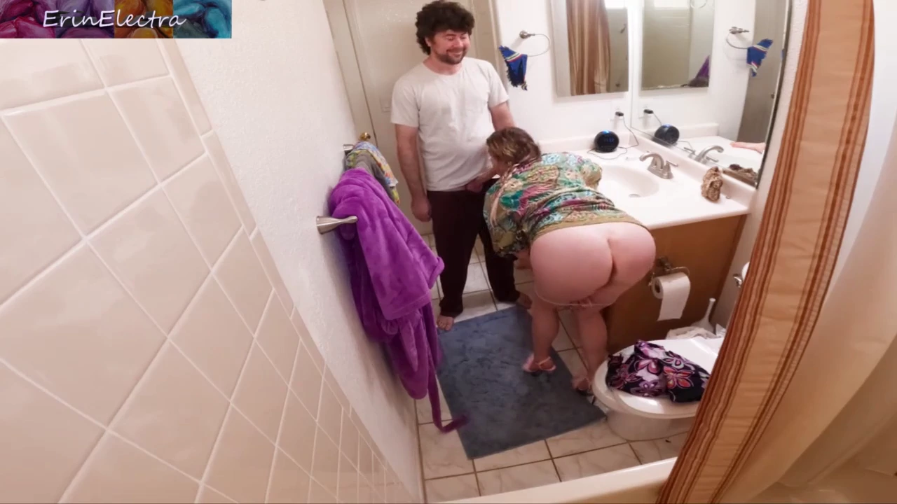 A busty housewife's intimate encounter with her stepson in the bathroom porn video